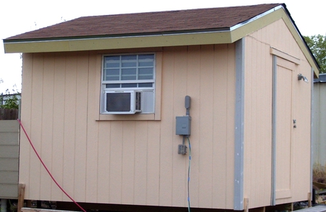 Small portable building with air conditioner