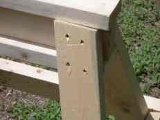Picture of construction detail of sawhorse showing how top rests on top of leg for extra strength and that legs angle outward to add to stability